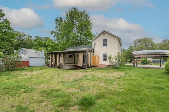 28 River St, Erving, MA 01344 - rear view of house with a lawn, a detached garage, and a wooden deck
