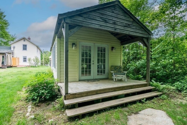 28 River St, Erving, MA 01344 - rear view of property featuring french doors, a yard, and a deck