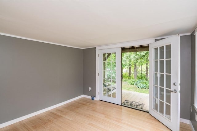 28 River St, Erving, MA 01344 - empty room with light wood-style floors, baseboards, and crown molding