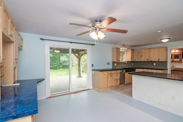 28 River St, Erving, MA 01344 - kitchen featuring stainless steel dishwasher, dark countertops, backsplash, a sink, and ceiling fan