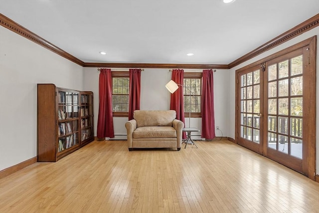 sitting room featuring ornamental molding, recessed lighting, baseboards, and hardwood / wood-style floors