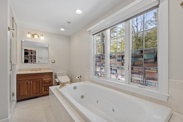 full bath with tile patterned flooring, toilet, recessed lighting, vanity, and a tub with jets