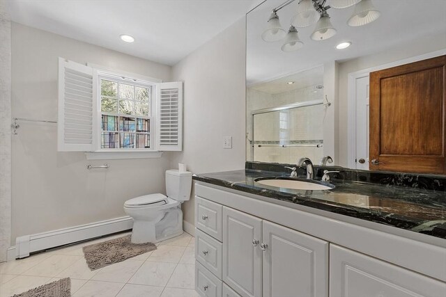 bathroom with toilet, a baseboard radiator, tile patterned floors, vanity, and a shower stall