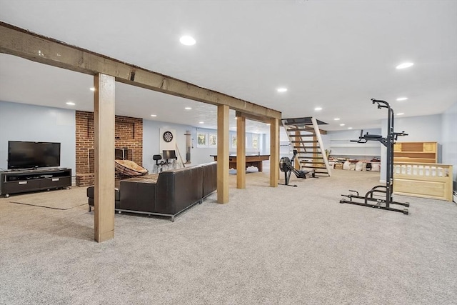 workout area featuring carpet floors, a brick fireplace, and recessed lighting