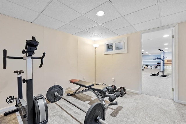 workout area featuring recessed lighting, carpet flooring, a paneled ceiling, and baseboards