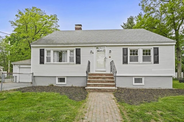20 Marjorie Rd, Wilmington, MA 01887 - view of front facade with entry steps, a chimney, roof with shingles, an outbuilding, and a detached garage