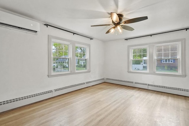 20 Marjorie Rd, Wilmington, MA 01887 - spare room with a wall unit AC, plenty of natural light, and wood finished floors