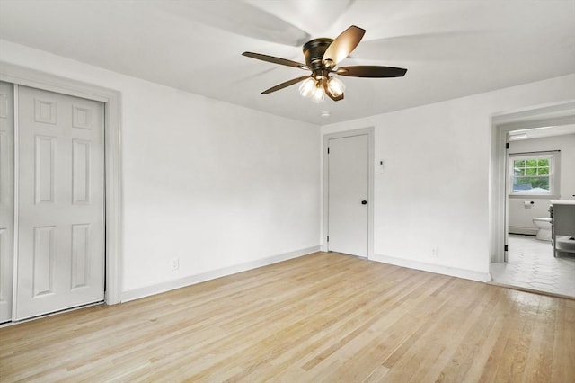 20 Marjorie Rd, Wilmington, MA 01887 - empty room with light wood-style floors, ceiling fan, and baseboards