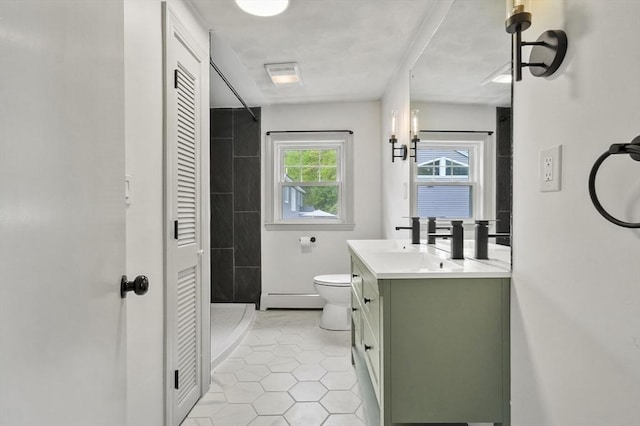20 Marjorie Rd, Wilmington, MA 01887 - full bathroom featuring a baseboard heating unit, a closet, vanity, toilet, and a tile shower