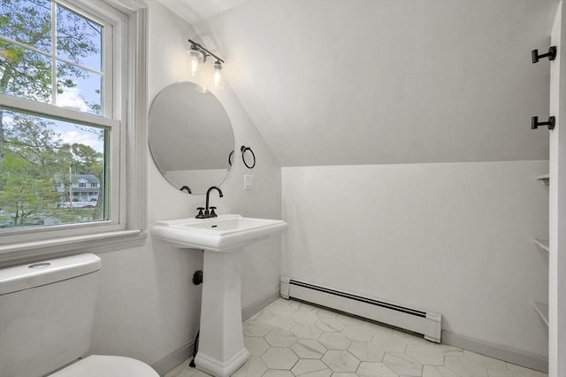20 Marjorie Rd, Wilmington, MA 01887 - bathroom with a baseboard radiator, healthy amount of natural light, vaulted ceiling, toilet, and baseboards