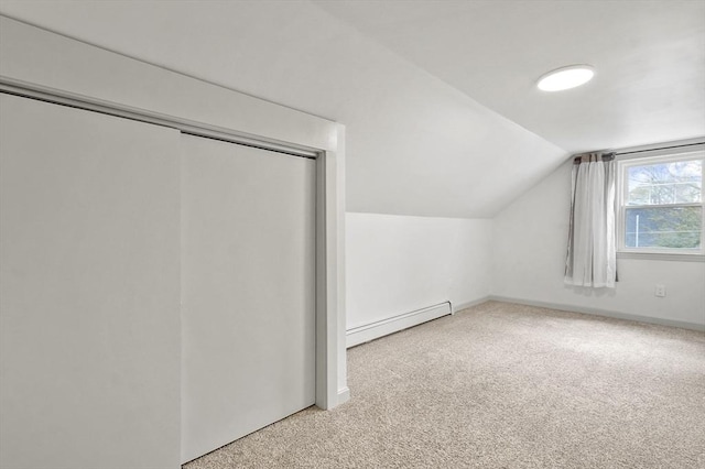 20 Marjorie Rd, Wilmington, MA 01887 - additional living space with a baseboard heating unit, lofted ceiling, carpet, and baseboards