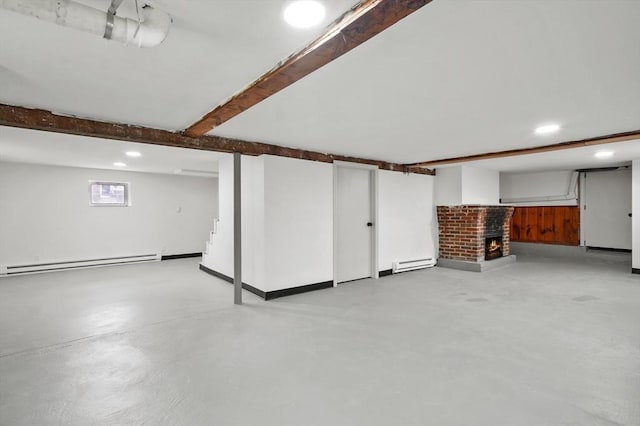 20 Marjorie Rd, Wilmington, MA 01887 - basement featuring baseboard heating, a brick fireplace, and recessed lighting