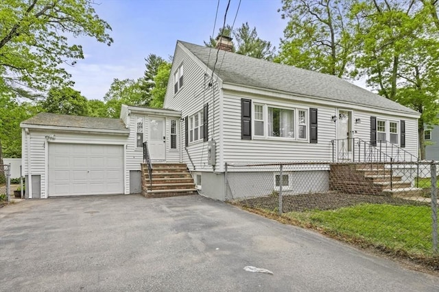 20 Marjorie Rd, Wilmington, MA 01887 - view of front of property with a chimney, a garage, driveway, and roof with shingles