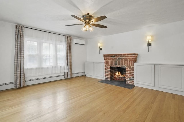 20 Marjorie Rd, Wilmington, MA 01887 - unfurnished living room with an AC wall unit, ceiling fan, a fireplace, and wood finished floors