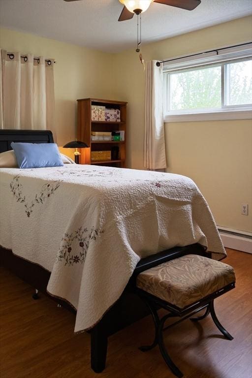 61 Outer Dr Unit 61, Chicopee, MA 01022 - bedroom with wood finished floors, a baseboard radiator, and a ceiling fan