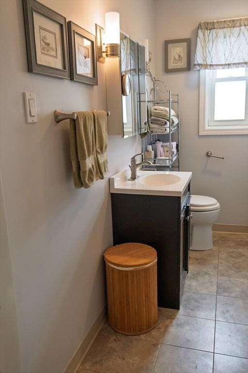 61 Outer Dr Unit 61, Chicopee, MA 01022 - bathroom with vanity, toilet, and baseboards
