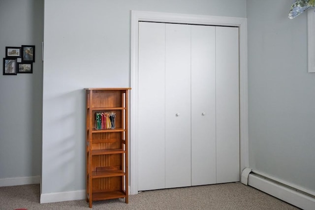 61 Outer Dr Unit 61, Chicopee, MA 01022 - carpeted bedroom with baseboard heating, a closet, and baseboards