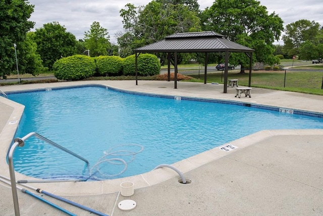 61 Outer Dr Unit 61, Chicopee, MA 01022 - community pool featuring a gazebo, a patio area, and view of wooded area
