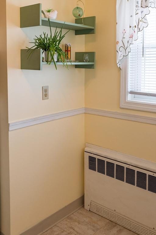 61 Outer Dr Unit 61, Chicopee, MA 01022 - laundry area with radiator and baseboards