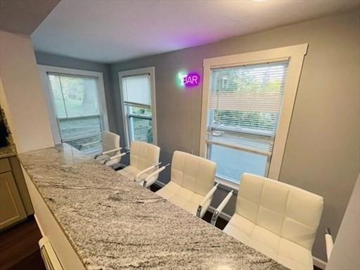 dining area with dark wood-type flooring