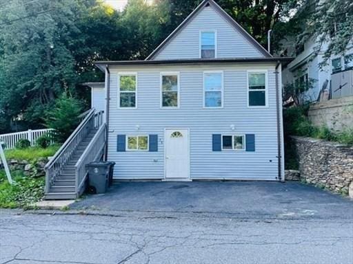 view of front of property featuring stairs