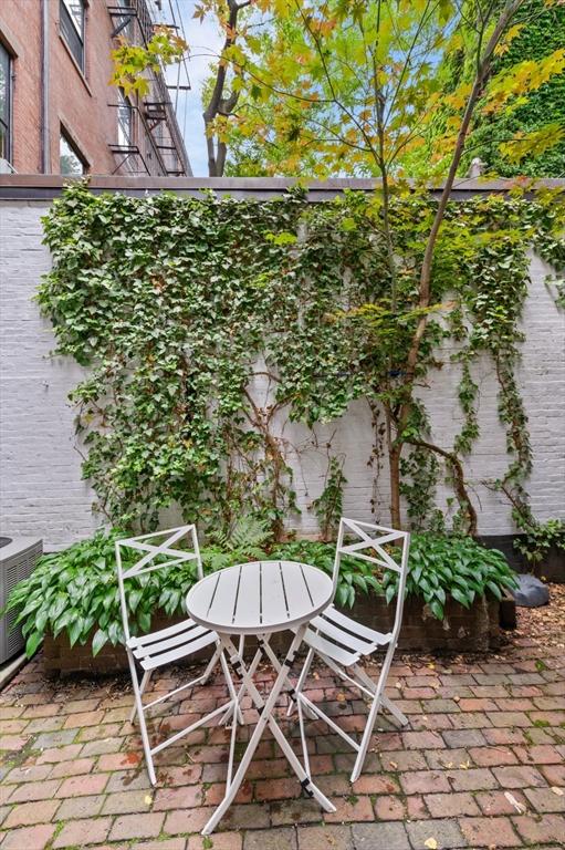 93 Pinckney Unit 1, Boston, MA 02114 - balcony with central AC and a patio area