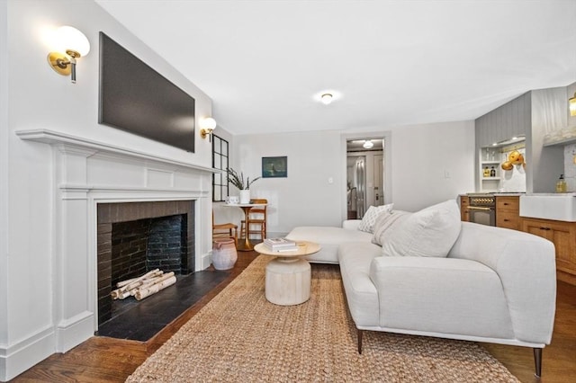 93 Pinckney Unit 1, Boston, MA 02114 - living area featuring wood finished floors and a fireplace