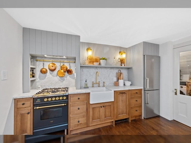 93 Pinckney Unit 1, Boston, MA 02114 - kitchen featuring open shelves, freestanding refrigerator, gas range, a sink, and decorative backsplash