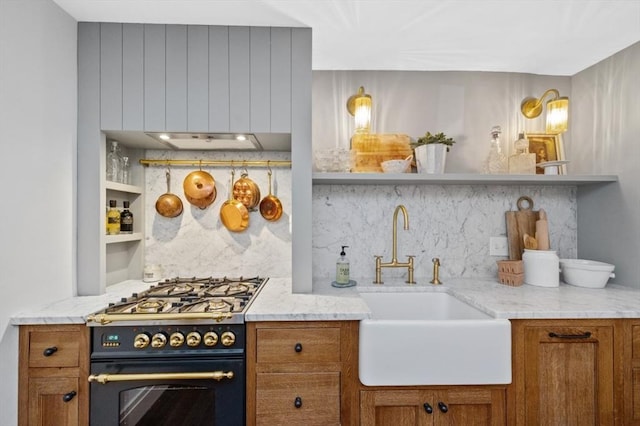 93 Pinckney Unit 1, Boston, MA 02114 - kitchen with range with gas cooktop, open shelves, a sink, backsplash, and brown cabinets