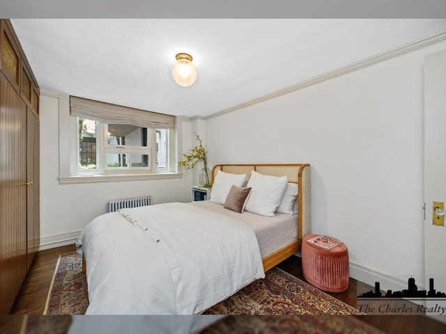 93 Pinckney Unit 1, Boston, MA 02114 - bedroom with radiator heating unit, wood finished floors, baseboards, and crown molding