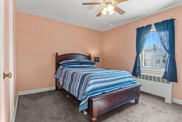 carpeted bedroom featuring ceiling fan and radiator heating unit