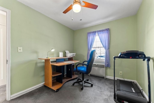 home office with carpet, radiator, and ceiling fan