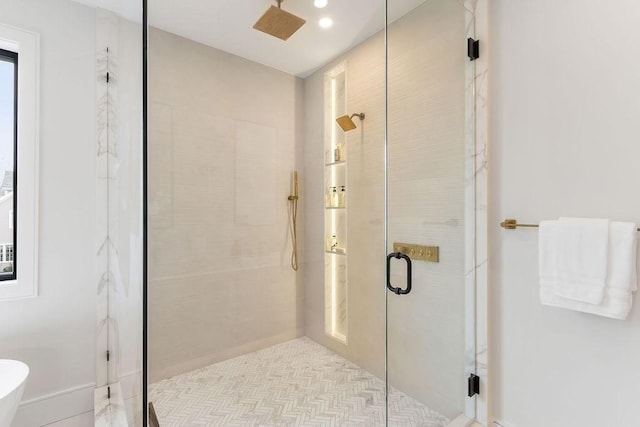 bathroom with a shower stall, recessed lighting, and a bathing tub