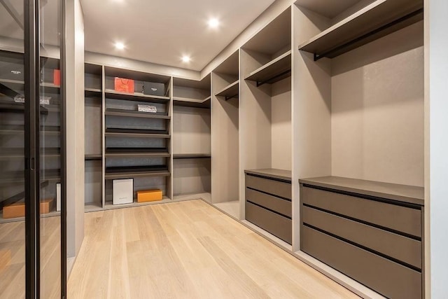 spacious closet with light wood finished floors