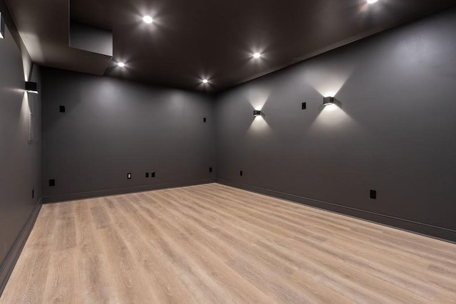 home theater featuring recessed lighting, baseboards, and wood finished floors