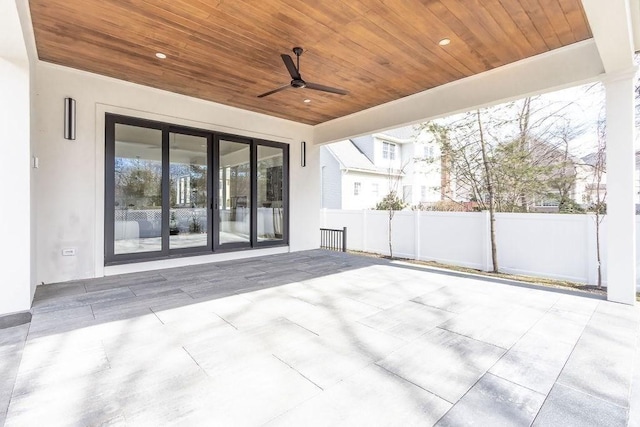 view of patio / terrace with a ceiling fan and fence