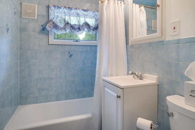 177 Elm St, Andover, MA 01810 - bathroom with vanity, tile walls, and shower / tub combo with curtain