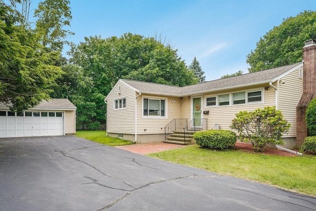 177 Elm St, Andover, MA 01810 - view of front facade with a front yard, a garage, and a chimney