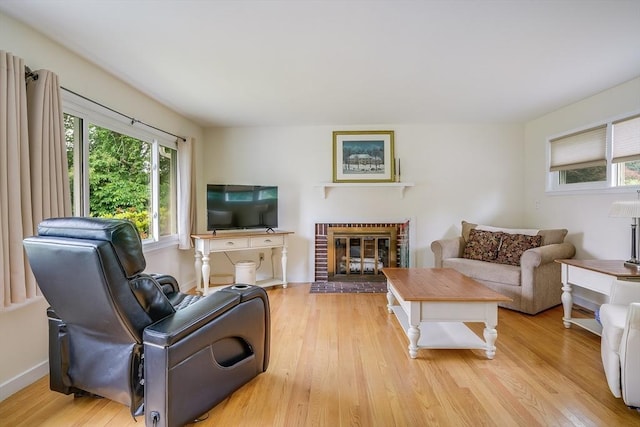 177 Elm St, Andover, MA 01810 - living room with wood finished floors and a brick fireplace