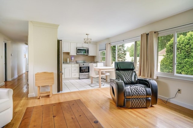 177 Elm St, Andover, MA 01810 - living room with baseboards and light wood-style floors