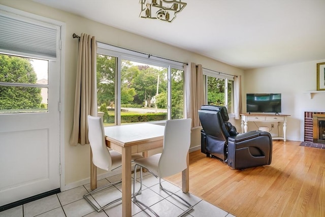 177 Elm St, Andover, MA 01810 - dining room featuring a chandelier and light tile patterned floors