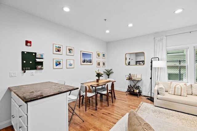 interior space with light wood-style floors, baseboards, and recessed lighting