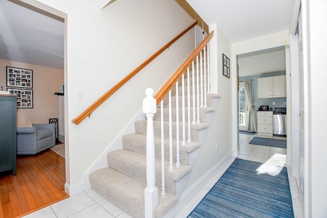 staircase with tile patterned flooring