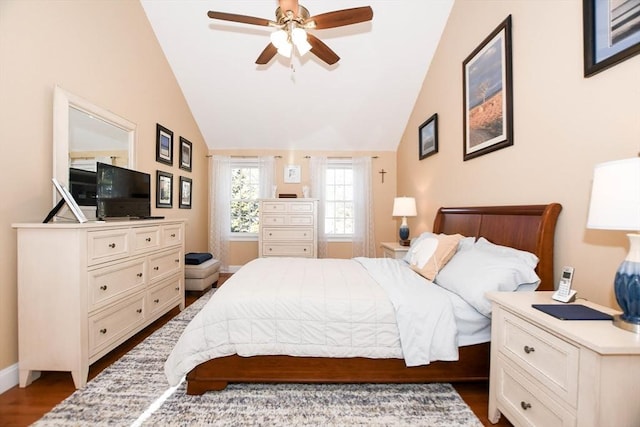 bedroom featuring hardwood / wood-style flooring, ceiling fan, and lofted ceiling