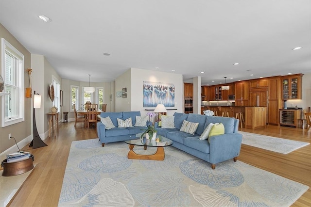 30 Preston Ct Unit 1, Swampscott, MA 01907 - living room with beverage cooler, light wood-style flooring, and recessed lighting