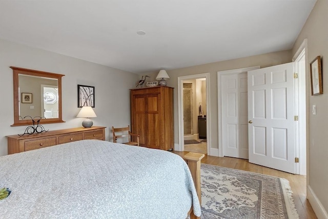 30 Preston Ct Unit 1, Swampscott, MA 01907 - bedroom with light wood-style flooring and ensuite bath