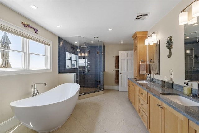 30 Preston Ct Unit 1, Swampscott, MA 01907 - bathroom featuring a stall shower, double vanity, a freestanding tub, recessed lighting, and tile patterned floors