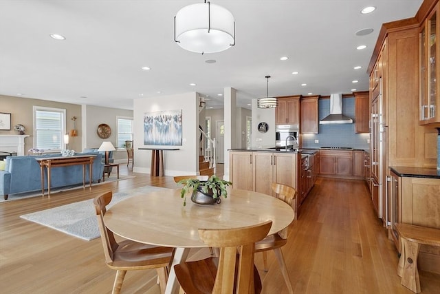 30 Preston Ct Unit 1, Swampscott, MA 01907 - dining area featuring light wood-style floors, recessed lighting, and a fireplace