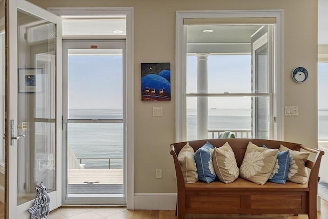 30 Preston Ct Unit 1, Swampscott, MA 01907 - doorway to outside with light tile patterned floors and a water view
