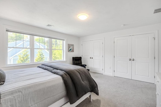 41 Old Main Rd Unit 3A, Falmouth, MA 02556 - carpeted bedroom with two closets, multiple windows, and baseboards